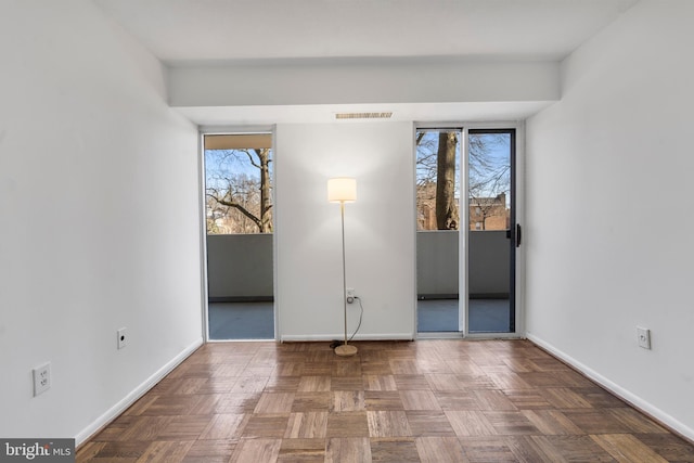 unfurnished bedroom with visible vents and baseboards