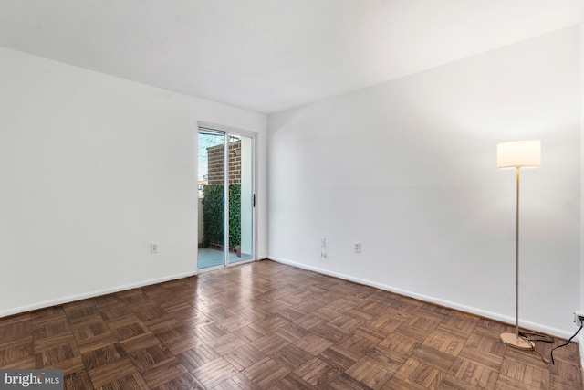 empty room with baseboards