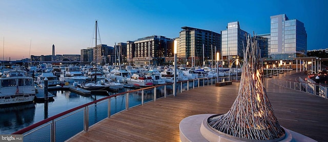 dock area with a view of city and a water view