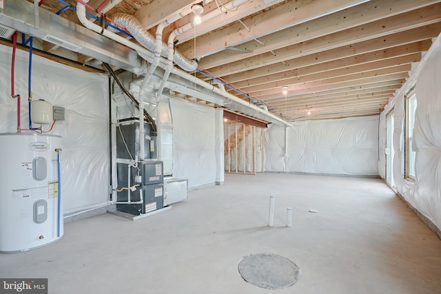 below grade area featuring water heater and heating unit