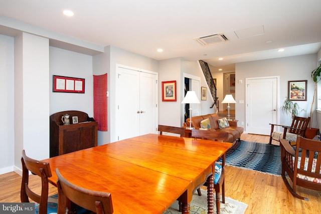 dining room with light wood-style floors, baseboards, visible vents, and recessed lighting