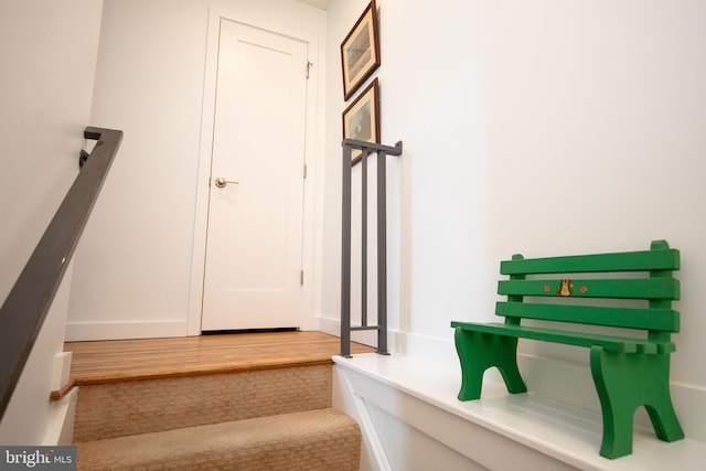 stairs with wood finished floors