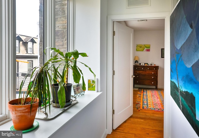 interior space featuring visible vents and wood finished floors