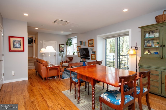 dining space with light wood-style floors, recessed lighting, visible vents, and plenty of natural light