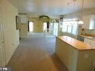 kitchen with open floor plan, light countertops, and a peninsula