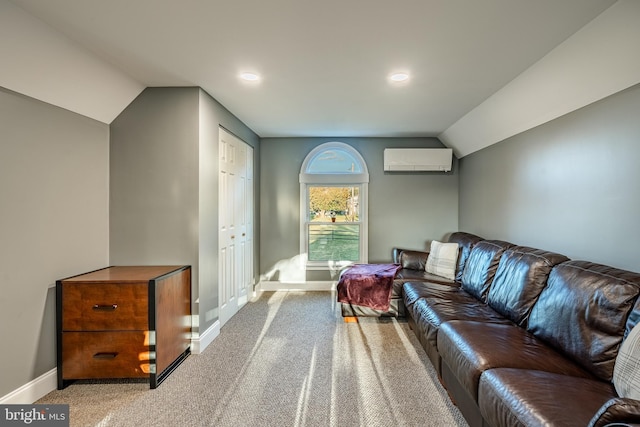 carpeted living room featuring an AC wall unit, baseboards, and vaulted ceiling