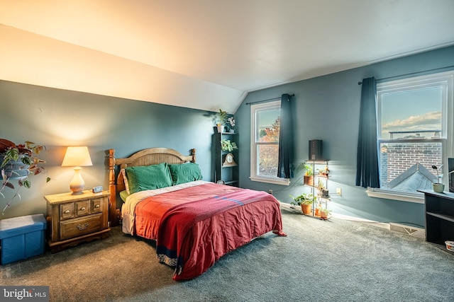 bedroom featuring lofted ceiling, carpet flooring, and baseboards