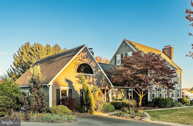 view of front of home with a chimney