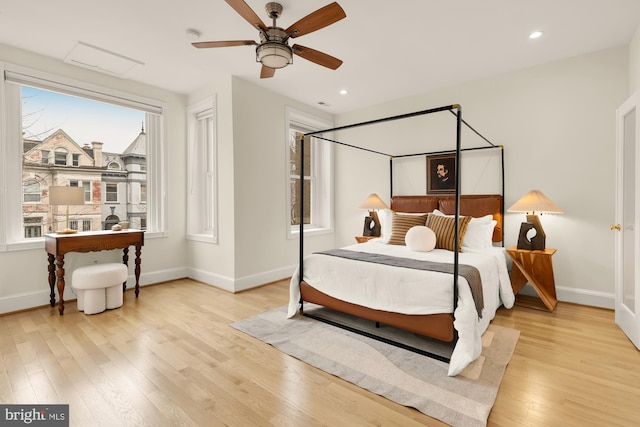 bedroom with baseboards, recessed lighting, a ceiling fan, and light wood-style floors