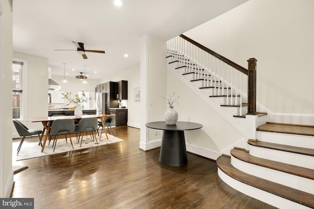 stairway featuring recessed lighting, ceiling fan, baseboards, and wood finished floors