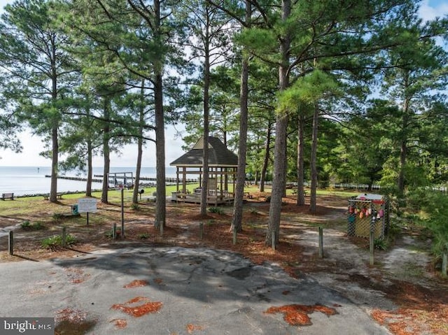 exterior space featuring a water view and a gazebo