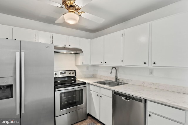 kitchen with a sink, white cabinetry, under cabinet range hood, and stainless steel appliances