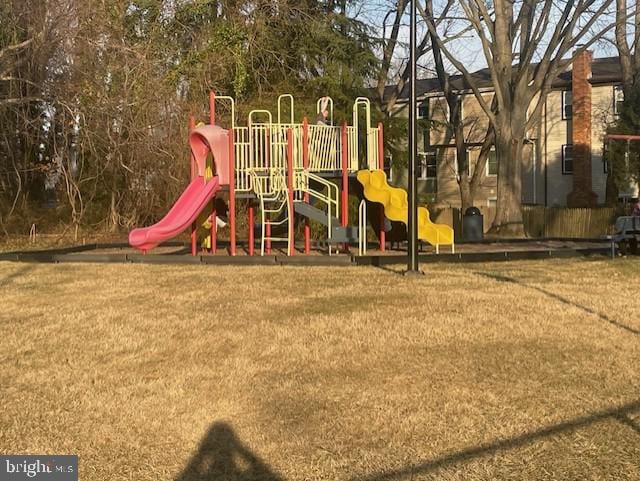 community play area with a lawn