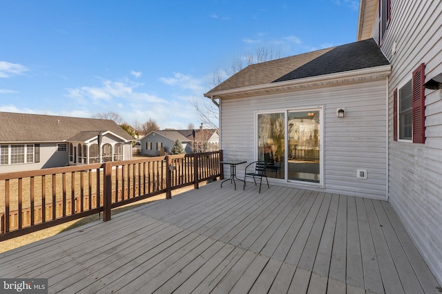 wooden terrace featuring a residential view