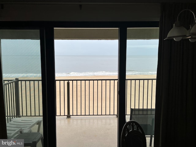 interior space featuring a view of the beach and a water view