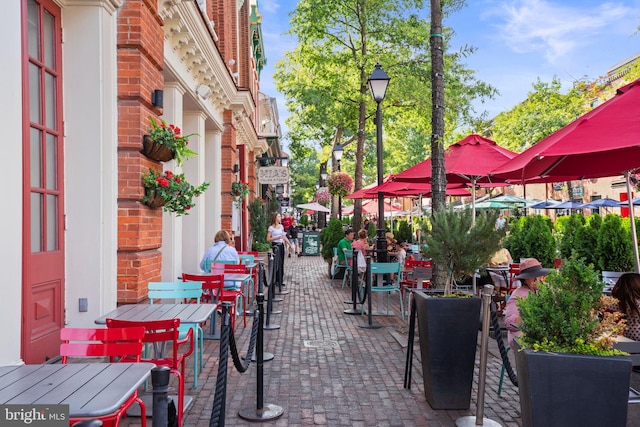 view of community featuring outdoor dining area