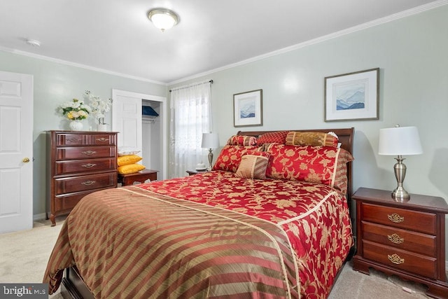 carpeted bedroom with crown molding and a closet