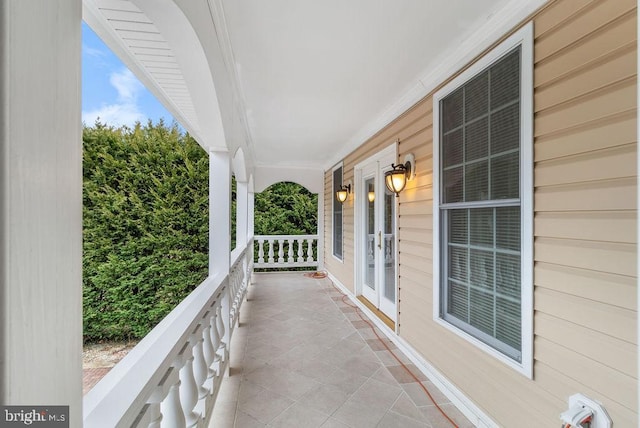 balcony with covered porch and french doors