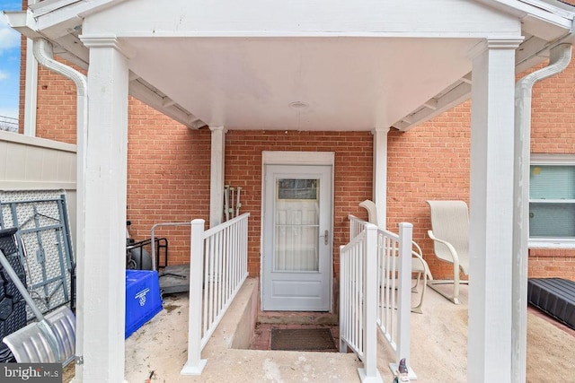 entrance to property with brick siding