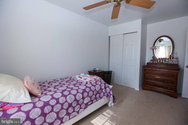 bedroom with carpet floors, a closet, and a ceiling fan