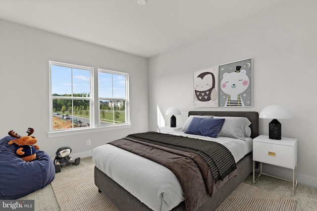 carpeted bedroom with baseboards