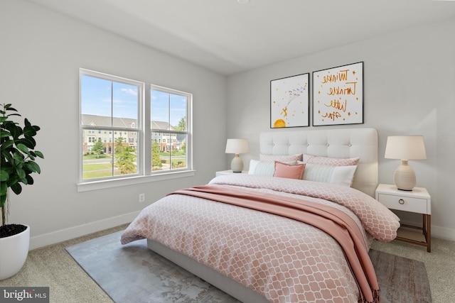 carpeted bedroom featuring baseboards