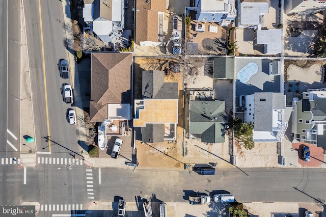 birds eye view of property with a residential view