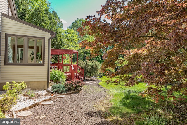view of yard featuring a deck