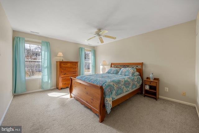 bedroom with a ceiling fan, carpet, visible vents, and baseboards