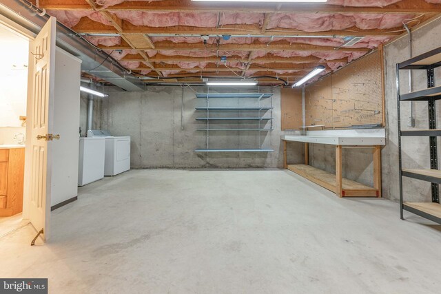 unfinished basement featuring independent washer and dryer