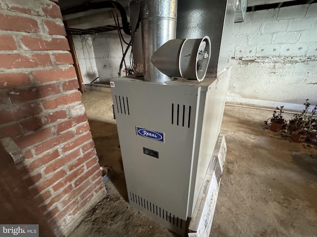 utility room featuring heating unit