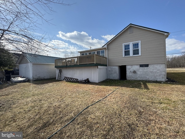 view of side of home featuring a yard and a wooden deck