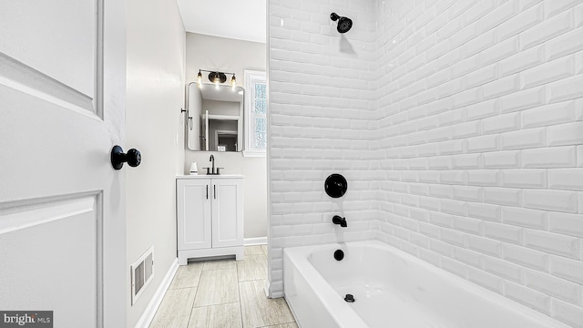 full bathroom with bathing tub / shower combination, vanity, and visible vents