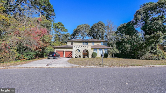 view of front of property featuring driveway and an attached garage