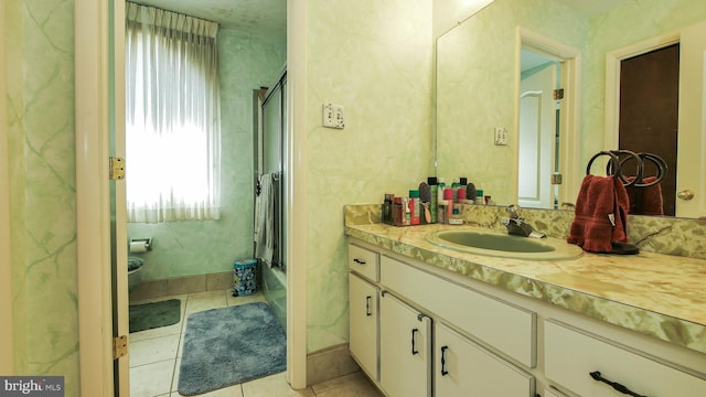 full bath featuring  shower combination, tile patterned flooring, and vanity