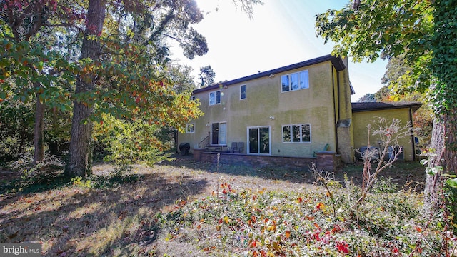 back of property with stucco siding