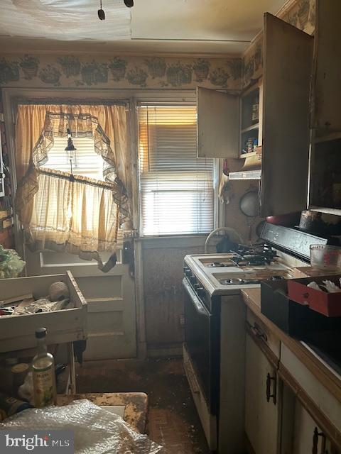 kitchen with white gas stove