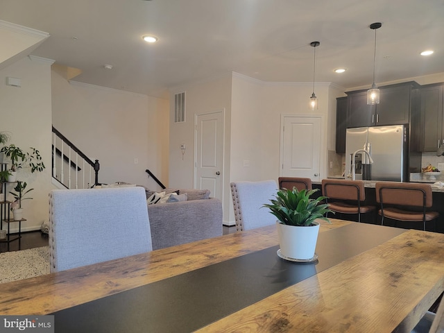 dining area featuring crown molding, stairs, visible vents, and recessed lighting