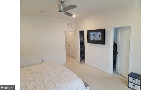 bedroom with light carpet, baseboards, visible vents, ceiling fan, and ornamental molding