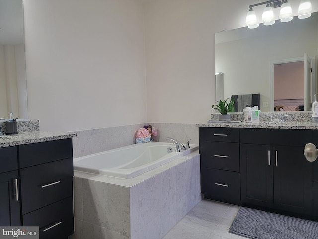 bathroom with a bath and vanity