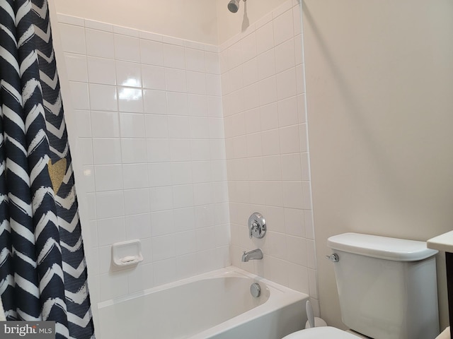 bathroom with shower / tub combo with curtain and toilet