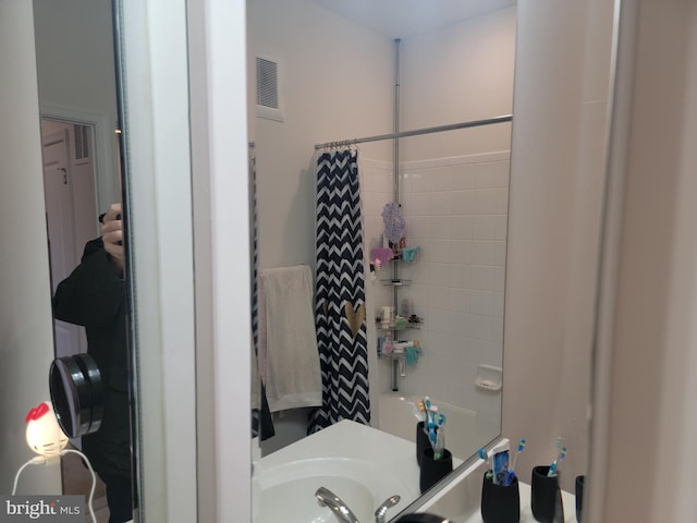 full bathroom with visible vents and shower / bath combination with curtain