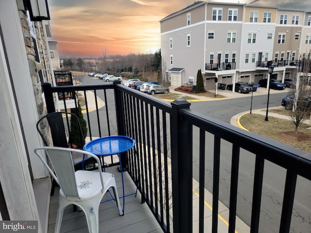 view of balcony at dusk