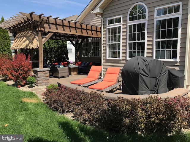 view of patio / terrace featuring an outdoor living space, grilling area, and a pergola