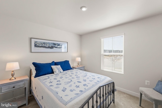 bedroom featuring carpet floors and baseboards