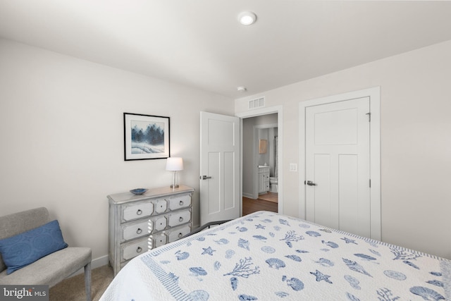 bedroom featuring visible vents and baseboards