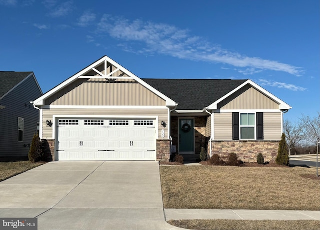 craftsman-style home featuring a garage, stone siding, board and batten siding, and concrete driveway