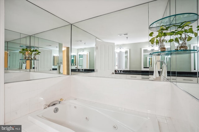 full bathroom featuring visible vents and a tub with jets