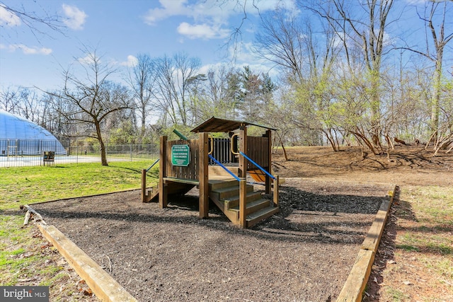 community jungle gym with fence