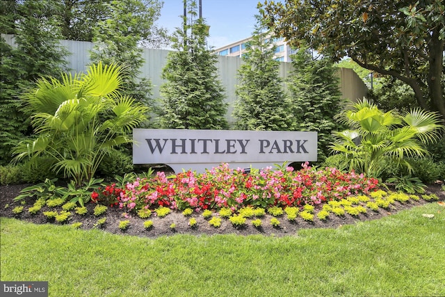 community sign featuring fence